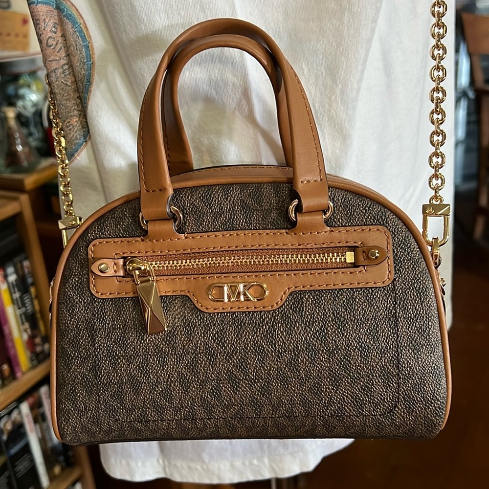 Small Michael Kors crossbody in coated canvas with leather trim.